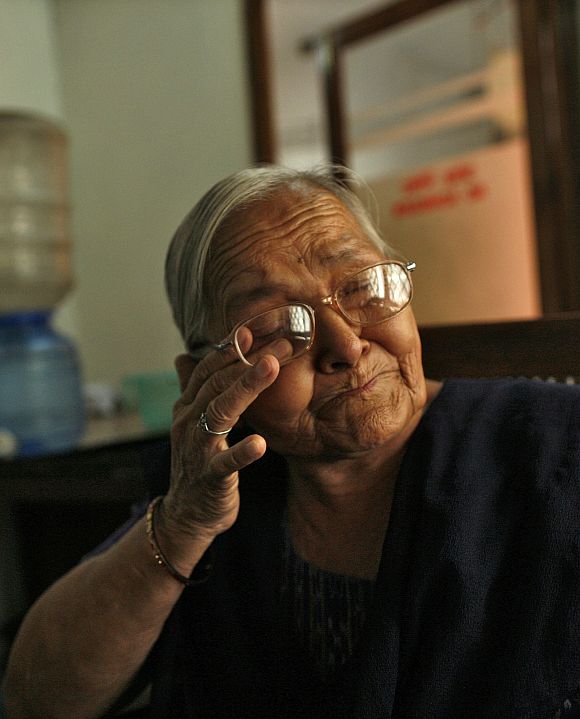 Kamla Devi, an employee who has served for 30 years, cries as she talks about her career, inside the Central Telegraph Office in New Delhi