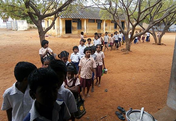 Primary school children form a neat line during lunch time