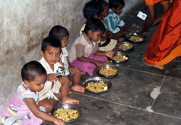 Tiny tots eating a hearty meal at the anganwadi in Nalumavadi revenue village 