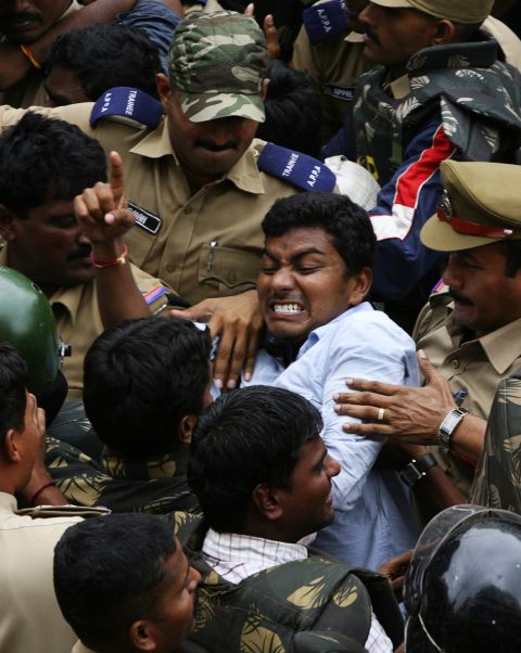 A Telangana supporter clashes with police during a demonstration in Hyderabad