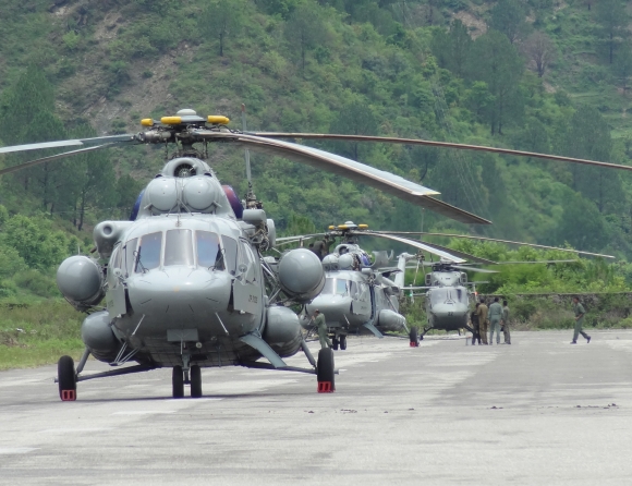 Helicopters parked on the makeshift airfield.
