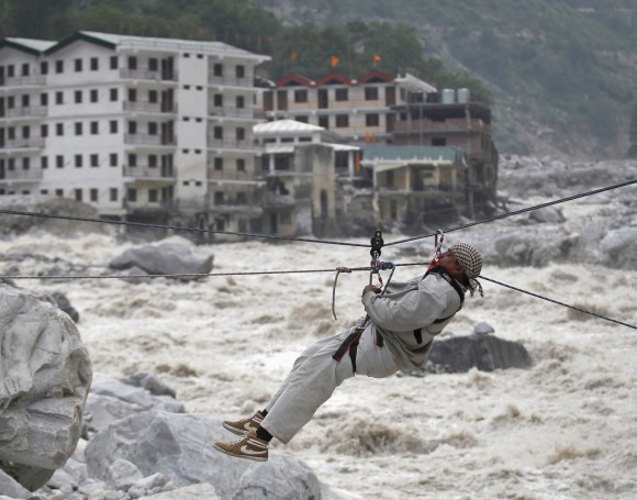 A man is pulled across to safety on a rope over the Alaknanda river in Uttarakhand.