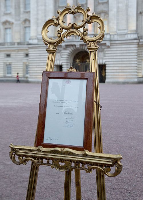 A notice formally announcing the birth of a son to Britain's Prince William and Catherine, Duchess of Cambridge, is placed in the forecourt of Buckingham Palace, in central London