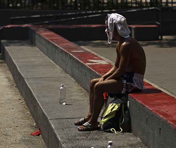 A man rests during a heat wave in Manhattan