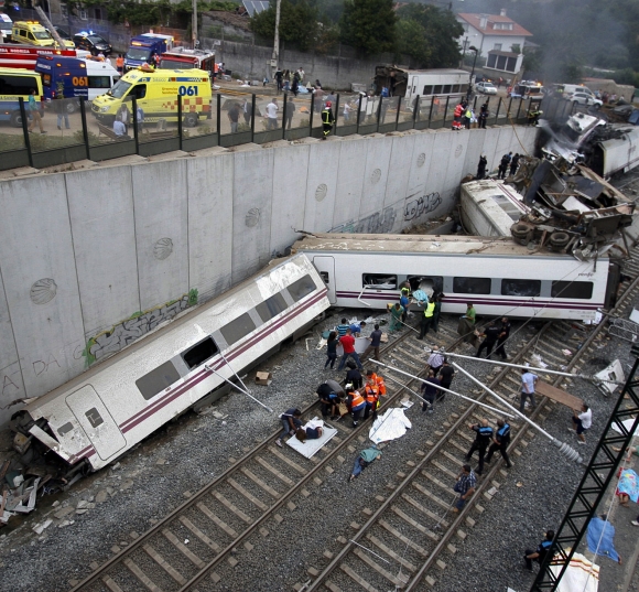 Rescue workers pull victims from a train crash near Santiago de Compostela, northwestern Spain