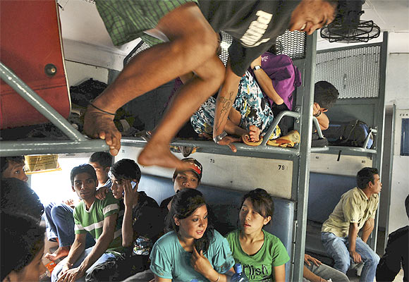 People from the North-East on a train on their way back to their homes at a railway station in Bangalore, August 17, 2012.
