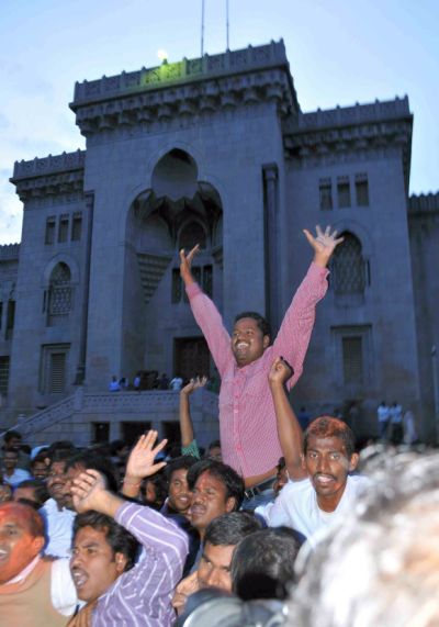 Osmania University students celebrate the declaration of a separate state of Telangana at the university campus in Hyderabad