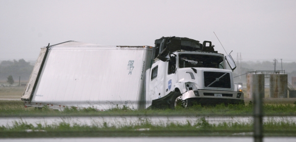 A semi tractor-trailer is seen damaged along Interstate-40 Westbound after a tornado hit the area just east of El Reno