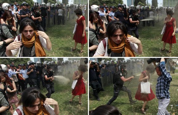 A combination photo of a Turkish riot policeman using tear gas against a woman as people protest against the destruction of trees in a park brought about by a pedestrian project, in Taksim Square in central Istanbul