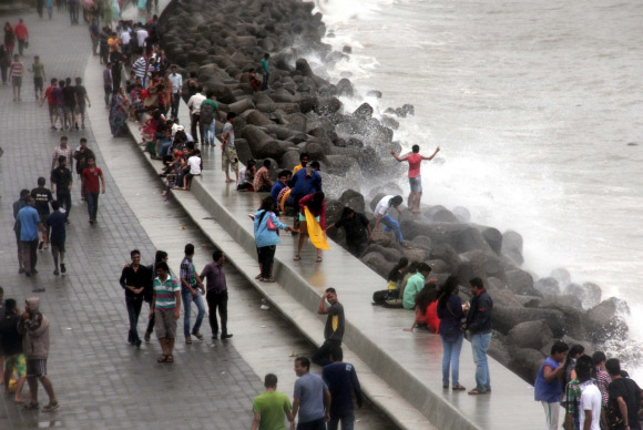 Mumbaikars enjoy the monsoon at Marine Drive