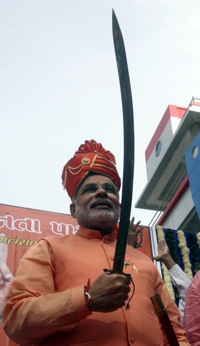 Modi poses with a sword in Ahmedabad