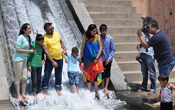 Tourists pose for pictures at Nishant Gardens