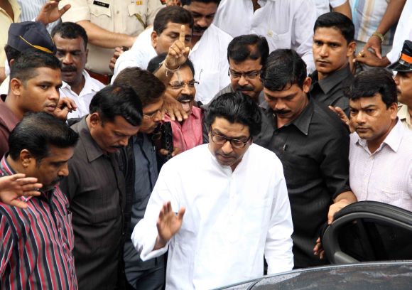 MNS chief Raj Thackeray waves to supporters as he steps out of a court in Bandra on Wednesday