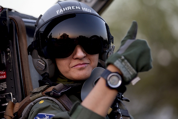 Ayesha gives the thumb-up sign from the cockpit of a Chinese-made F-7PG fighter jet at Mushaf base in Sargodha, north Pakistan