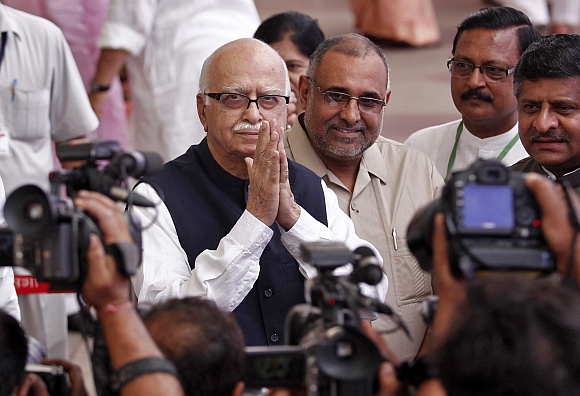 Advani gestures as he arrives to cast his vote during an election for the ceremonial post of president in New Delhi July in this photograph taken on 19, 2012