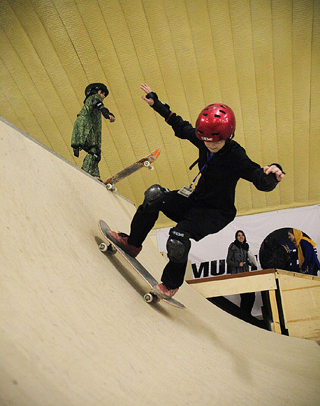 A Skateistan student rides down the ramp at the facility in Kabul