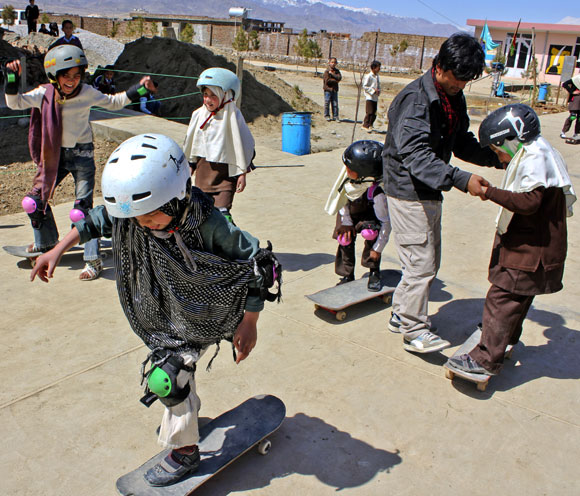 A Skateistan volunteer instructs new entrants on how to use the skateboard in Mazar-e-Sharif. The second facility opened this March after the success of the first project in Kabul and is almost three times the size of Skateistan Kabul