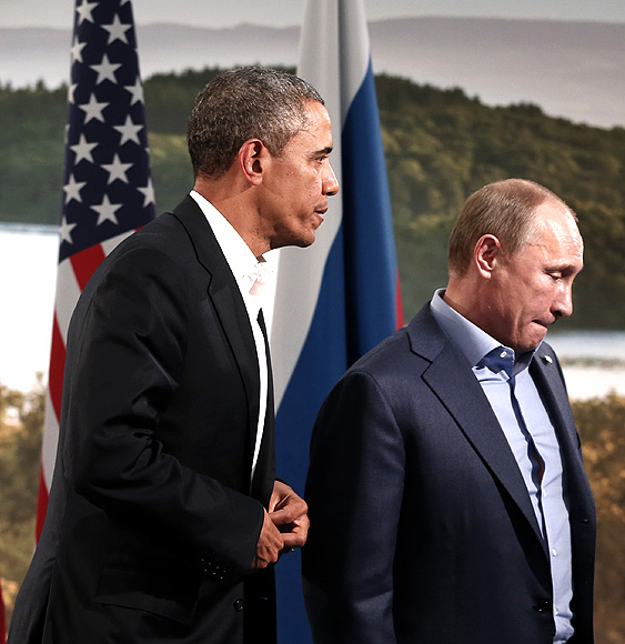 Obama and Putin walk away after their meeting during the G8 Summit