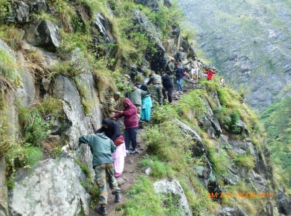 Army personnel rescuing stranded people in rain-ravaged Uttarakhand