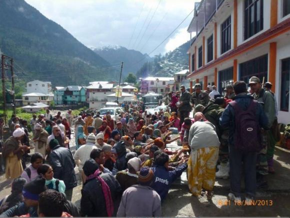 Food and water being provided to stranded people by army in rain-ravaged Harsil, Uttarakhand