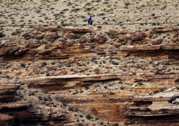 Wallenda pauses in the middle of his stunt across the canyon