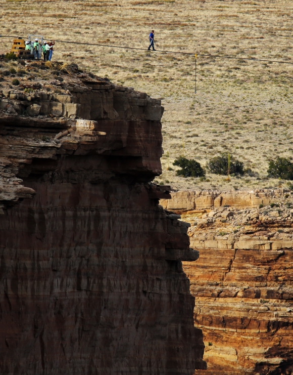 Wallenda balances himself as he walks the tightrope above Grand Canyon