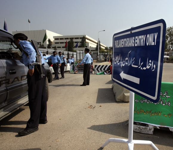 Policeman check vehicles entering the National Assembly in Islamabad Pakistan