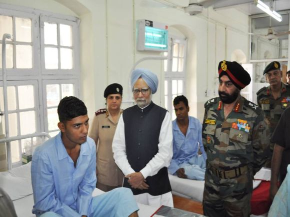 Dr Singh inquires wellbeing of an injured jawan in Srinagar on Tuesday