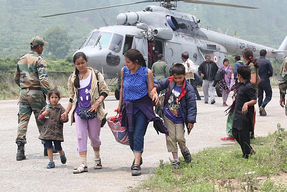 Pilgrims rescued from Gangotri arrive at Dharasu, Uttarakhand