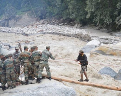 Soldiers rescue a tourist stranded in flood-hit Uttarakhand