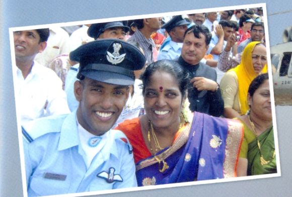 A photograph of K Praveen with his mother, from the family album
