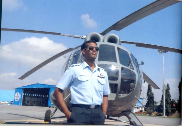 A photograph of K Praveen with his helicopter, from the family album