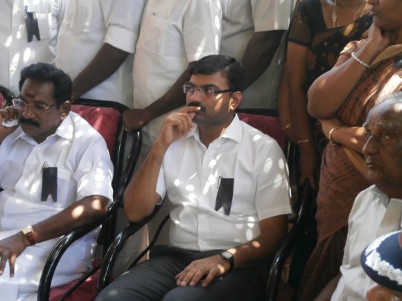 Tamil Nadu Minister for Cooperation Sellur K Raju and the outgoing collector of Madurai, Anshul Mishra, at K Praveen's funeral