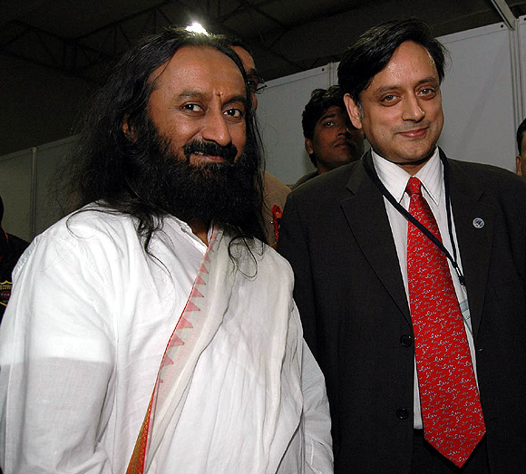 Corruption is one of the biggest ills that ails India, says Sri Sri Ravi Shankar, seen here with Union Minister of State for Human Resource Development Shashi Tharoor.