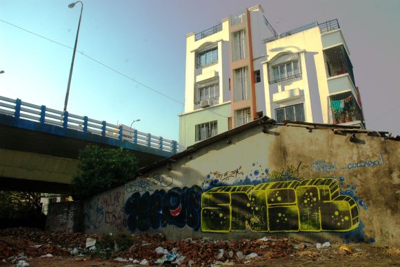 All flyovers, road divides, footpath sides, etc in Kolkata have been painted blue and white