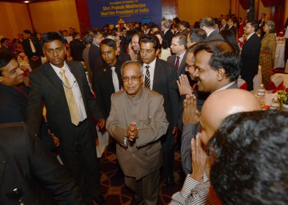 President Pranab Mukherjee is greeted by dignitaries during a function in Dhaka on Monday