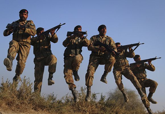 Pakistani soldiers participate in a military exercises in the Cholistan desert, near the India-Pakistan border.
