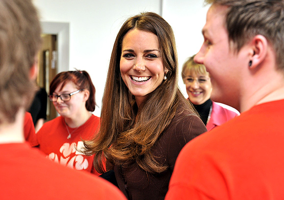 Britain's Catherine, Duchess of Cambridge speaks with unemployed young people who are taking part in The Prince's Trust Scheme, during her visit to Peaks Lane fire station in Grimsby, northern England March 5, 2013.