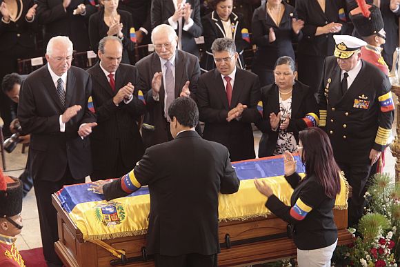 Venezuela's Vice-President Nicolas Maduro presides over the funeral ceremony for Hugo Chavez at the military academy in Caracas on Friday.