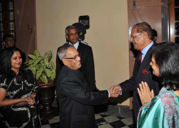 President Pranab Mukherjee meets his Mauritius counterpart Rajkeswur Purryag at Port Louis. Also seen in the picture is Mukherjee's daughter Sharmistha (extreme left) and Purryag's wife