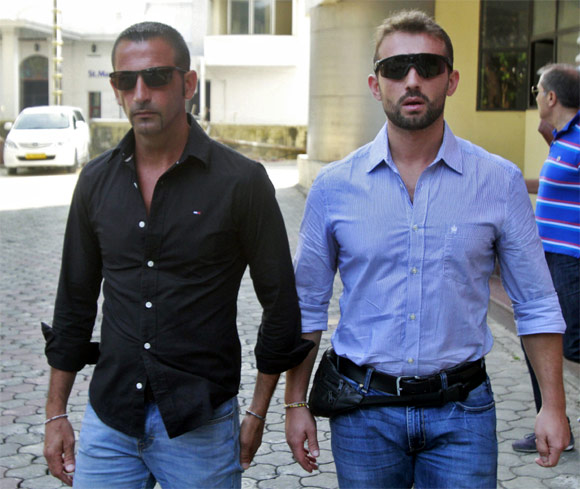 Italian sailors Salvatore Girone and Massimiliano Latorre leave the police commissioner's office in Kochi