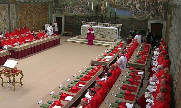 Cardinals sit in the Sistine Chapel to begin the conclave in order to elect a successor to Pope Benedict, in a still image taken from video at the Vatican