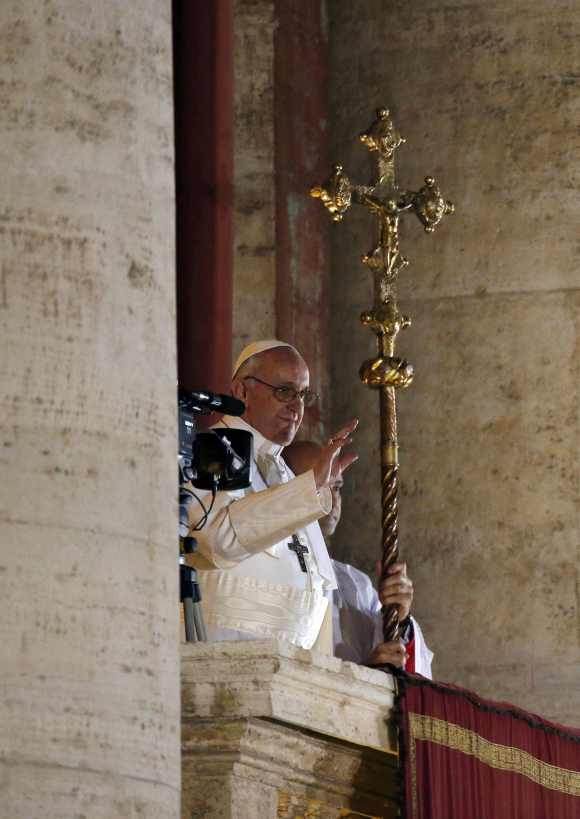 Pope Francis appears on the balcony of St. Peter's Basilica
