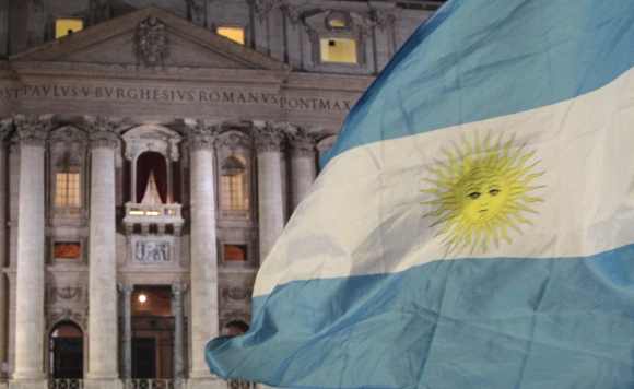 Faithful wave Argentina's flag after white smoke rose from the chimney above the Sistine Chapel