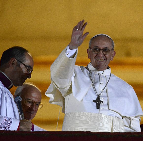 Newly elected Pope Francis, Cardinal Jorge Mario Bergoglio of Argentina appears on the balcony of St Peter's Basilica after being elected by the conclave of cardinals