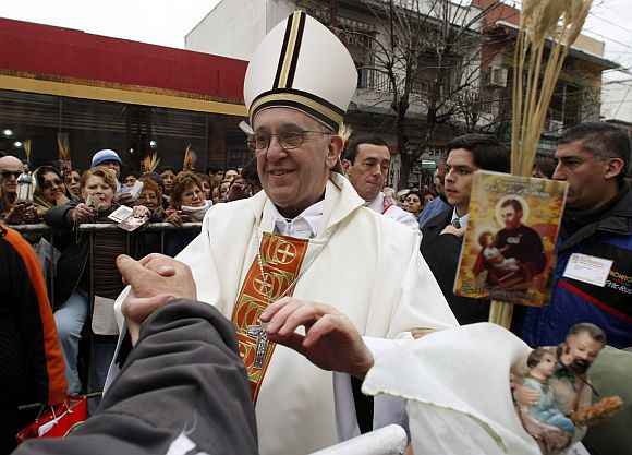 File photo shows Jorge Bergoglio, then Archbishop of Buenos Aires, greeting worshippers during the annual gathering and pilgrimage to the church dedicated to San Cayetano (Saint Cajetan), the patron saint of labor and bread, in the Buenos Aires neighbourhood of Liniers