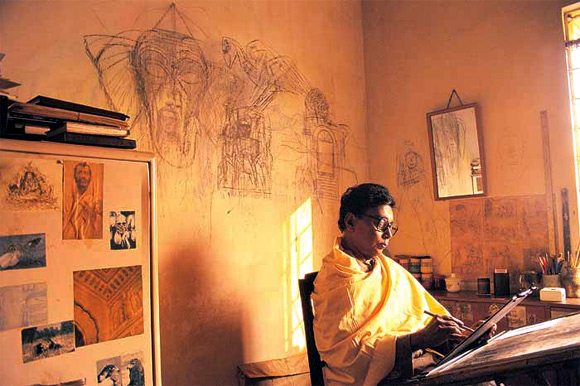 Legendary painter Ganesh Pyne immersed in his art.