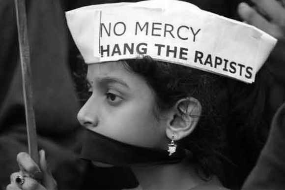 A girl participates in a protest against rape