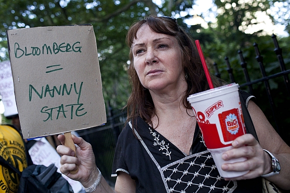 Andrea Hebert of New York, protests the proposed 'soda-ban', that New York City Mayor Michael R Bloomberg has suggested, outside City Hall in New York
