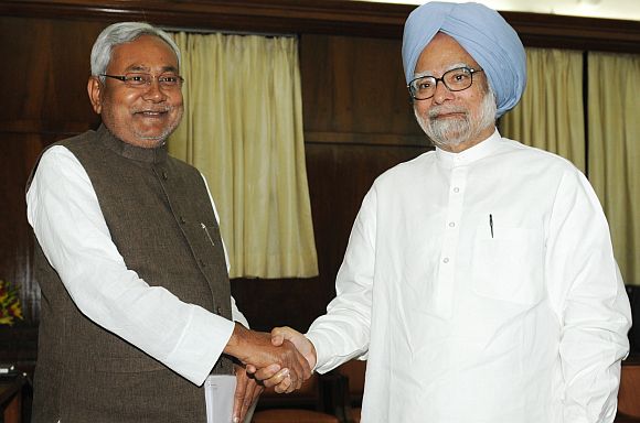 Bihar Chief minister Nitish Kumar with PM Singh